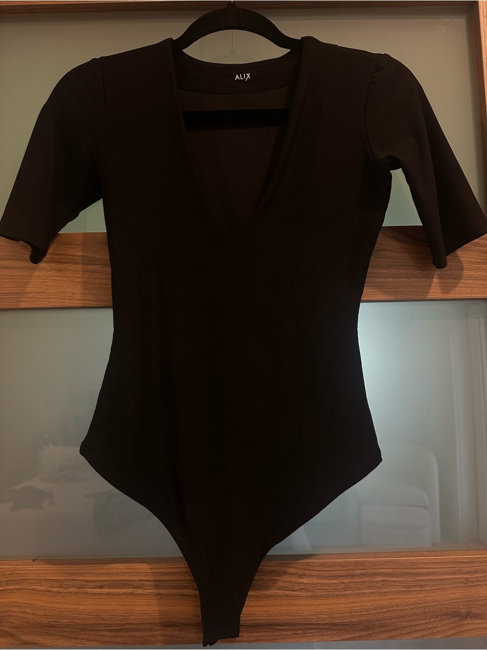 ALIX NYC Black V-Neck Short Sleeve Bodysuit
